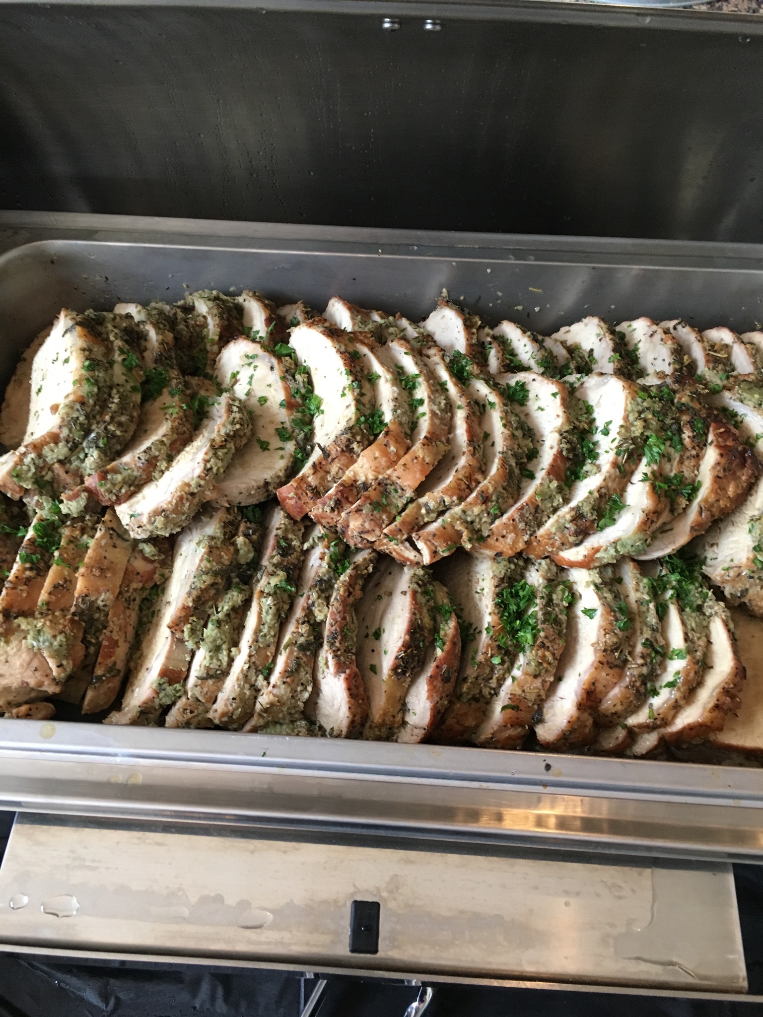 Herb crusted roast Canadian back pork loin, sliced