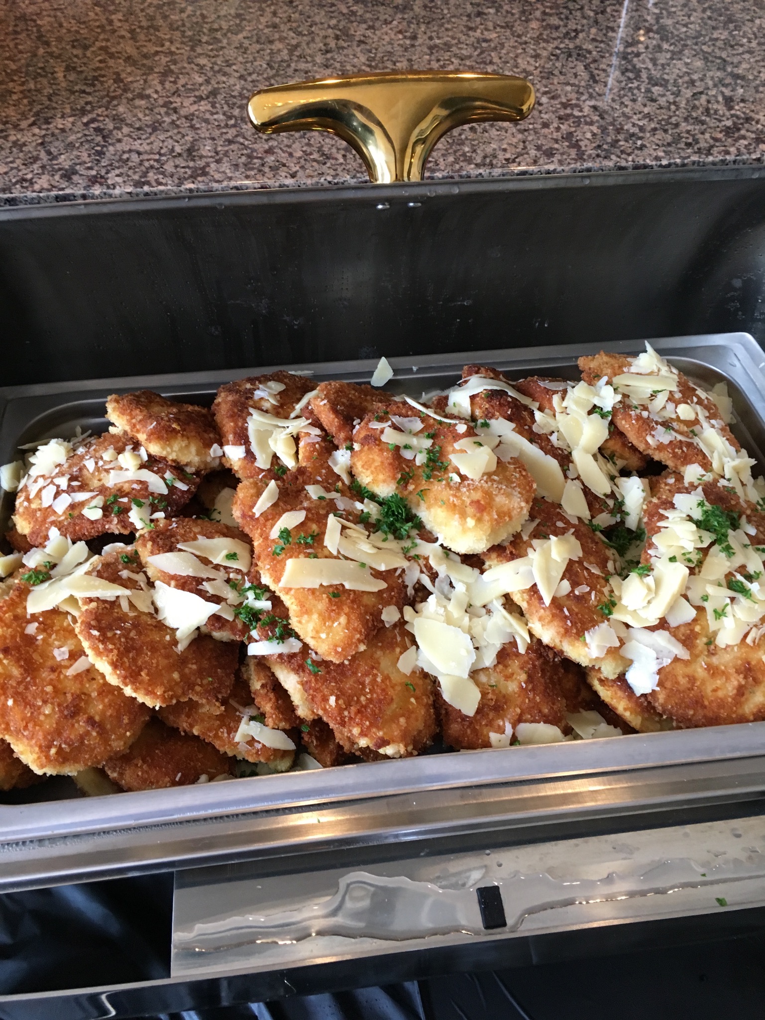 Chicken Milanese topped with shaved grana padano