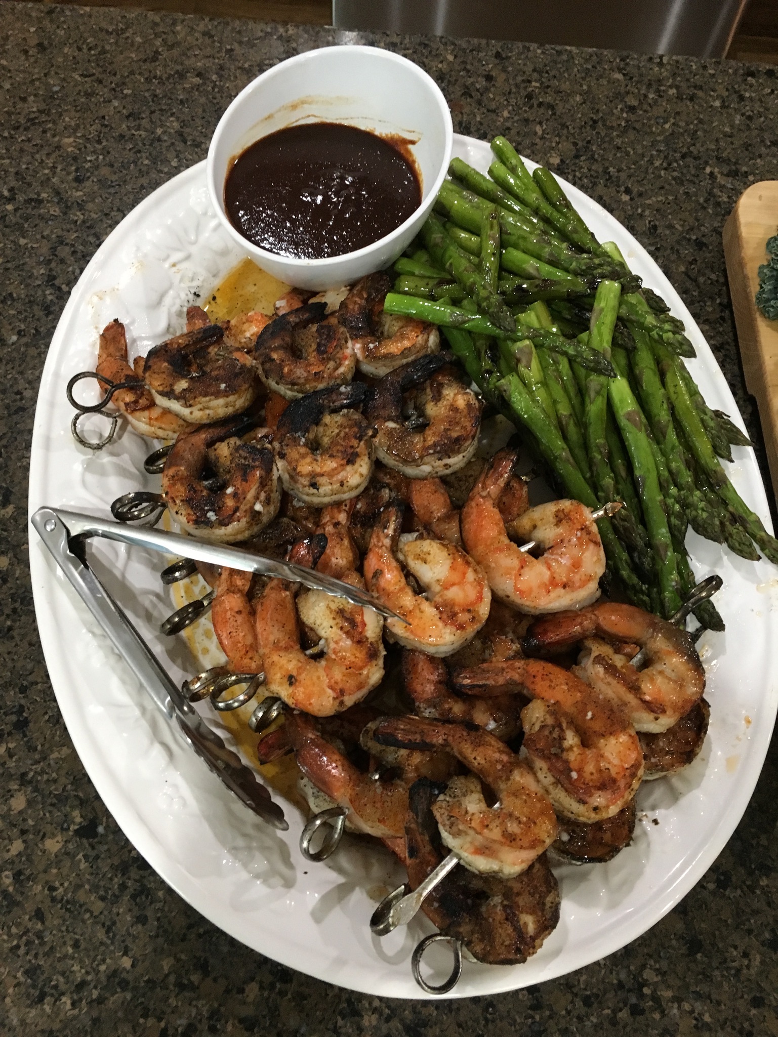 Cajun jumbo shrimp kebabs with grilled asparagus and Cajun pecan barbecue sauce
