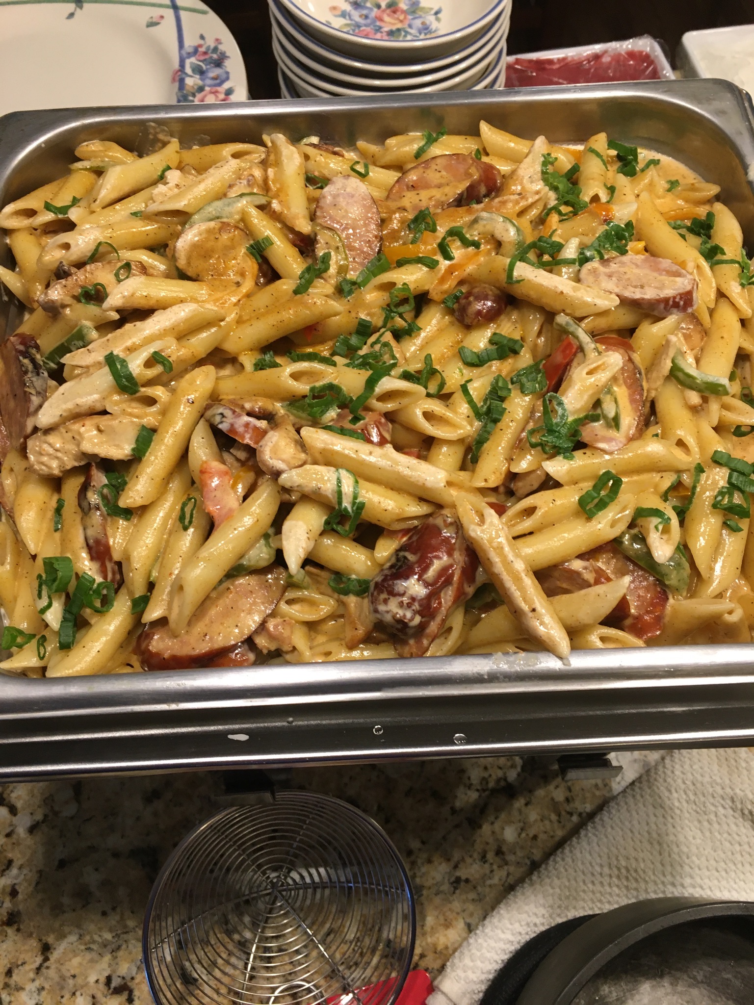 Cajun cream pasta with blackened chicken, grilled andouille, and sweet peppers