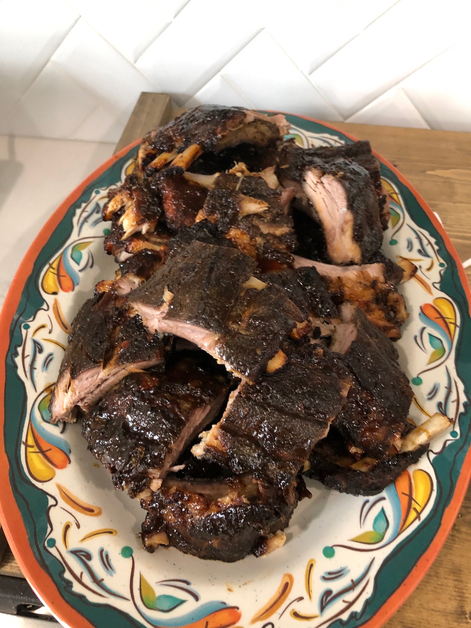 Smoked pork back ribs with pineapple bourbon glaze on a platter