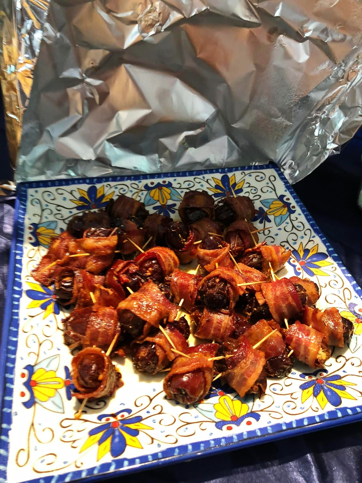 Goat cheese stuffed bacon wrapped dates with hot honey and maple glaze